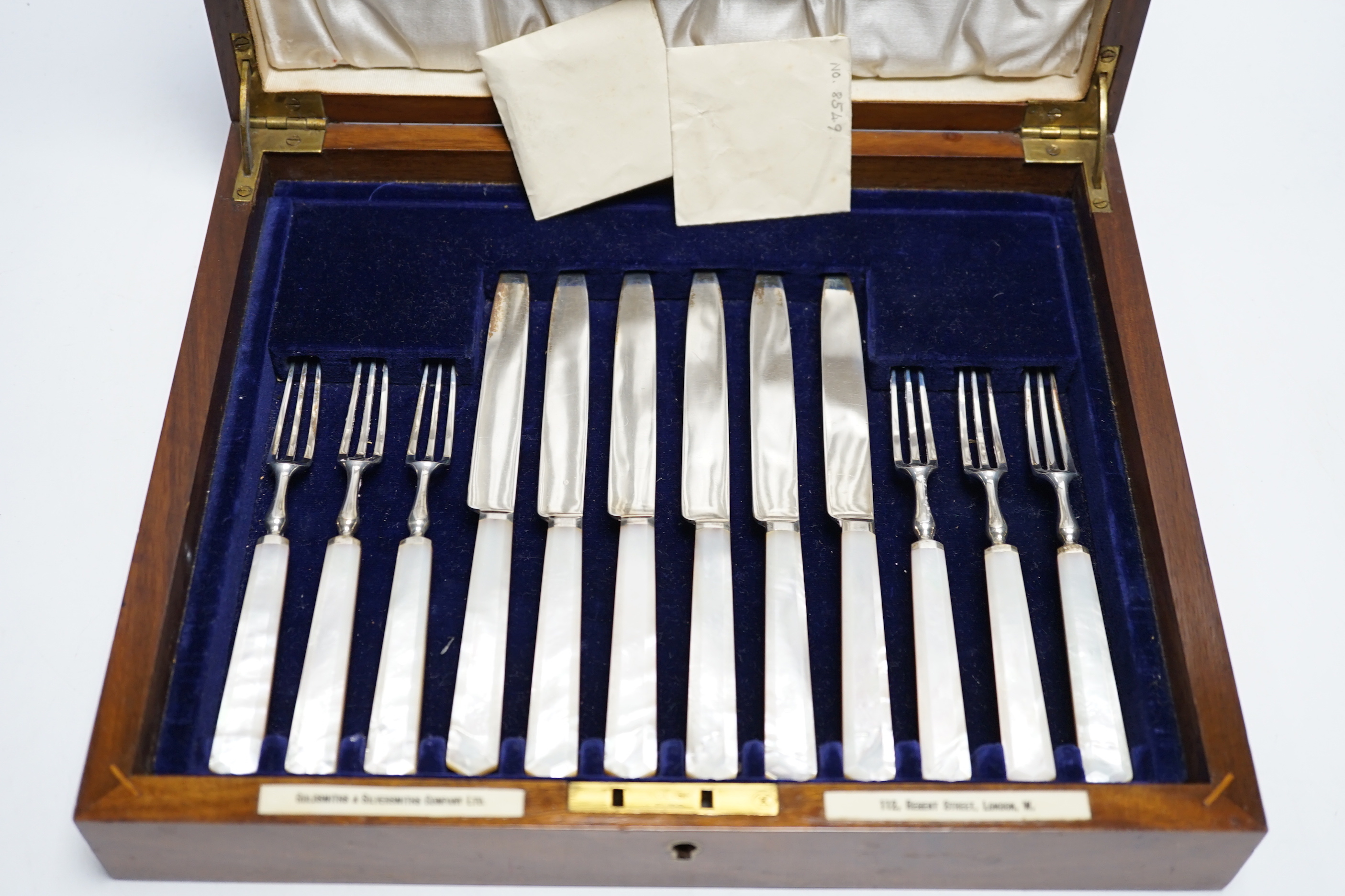 A cased set of twelve pairs of George V mother of pearl handled silver dessert eaters, Goldsmiths & Silversmiths Co Ltd, Sheffield, 1934, knife 19cm.